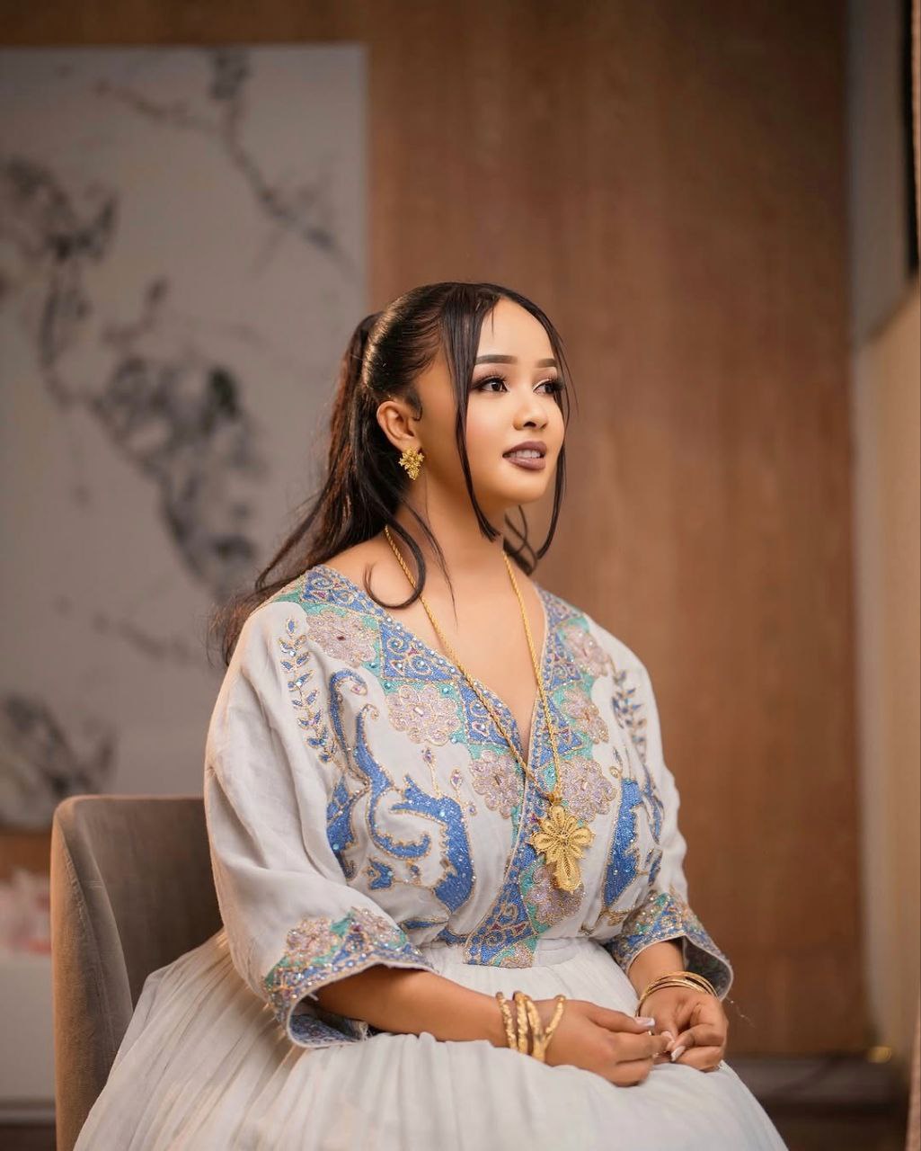 Graceful Habesha Kemis with Pastel Blue and Gold Embroidery for Engagements and Celebrations