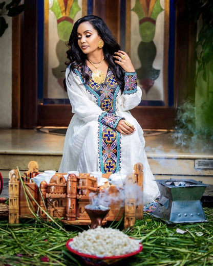 Elegant Habesha Dress with Bold Blue Embroidery for Church Ceremonies and Cultural Events