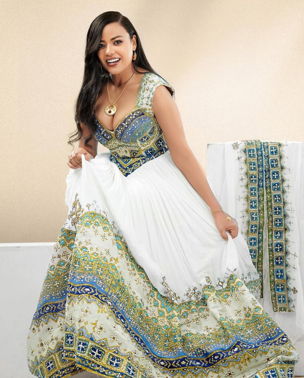 Elegant Habesha Kemis with Gold, Green and Sea Blue Details for Wedding and Events