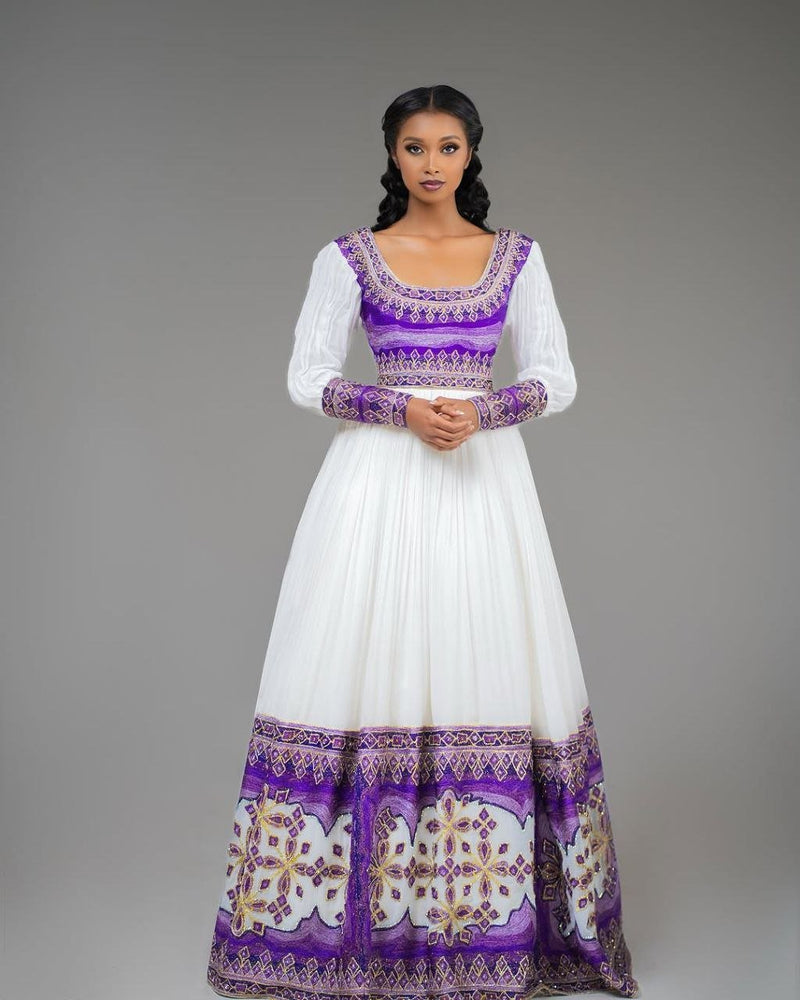Glamorous Habesha Dress with Intricate Purple Embroidery: A Beautiful Ethiopian Wedding Dress

