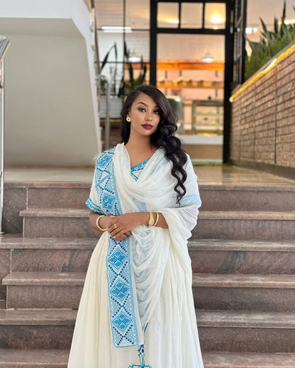 Elegant Habesha Dress with Striking Light Blue Embroidery for Cultural Events
