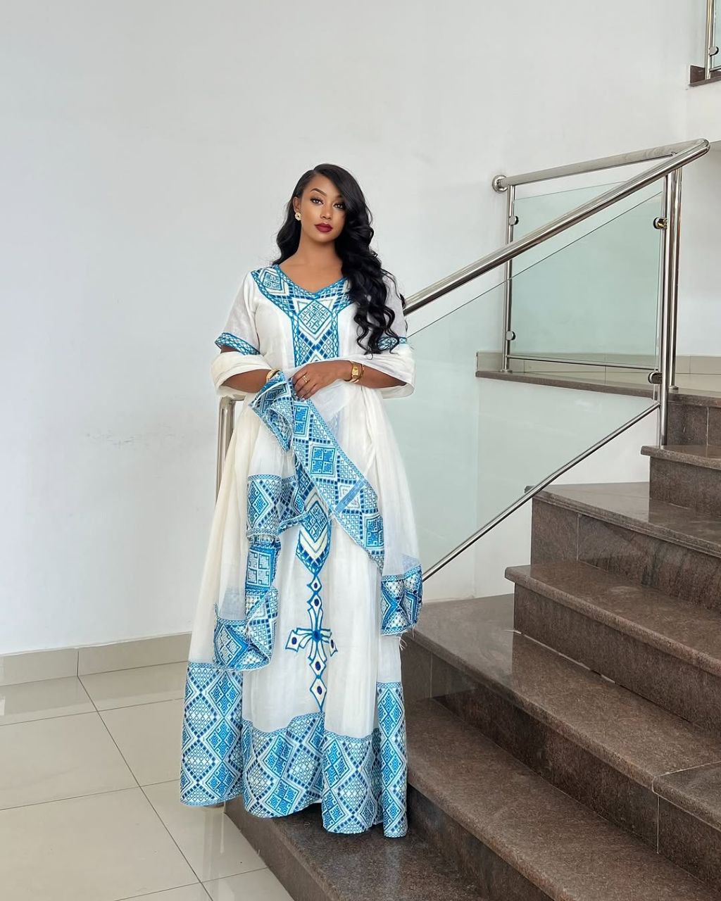 Elegant Habesha Dress with Striking Light Blue Embroidery for Cultural Events