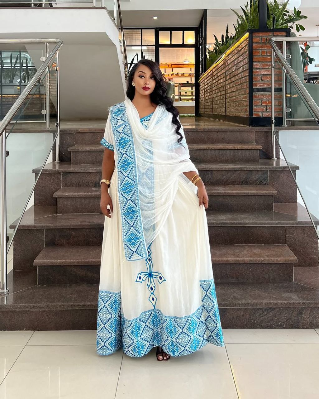 Elegant Habesha Dress with Striking Light Blue Embroidery for Cultural Events