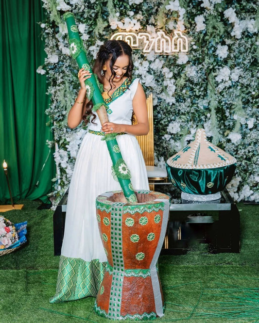 Elegant Habesha Wedding Dress with Stunning Green Embroidery For Celebration

