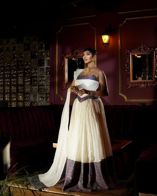 Stunning Habesha Dress with Elegant Purple Accents for Special Occasions
