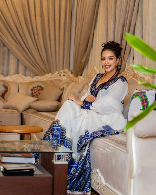 Elegant Habesha Dress with Rich Blue Embroidery for Cultural Events
