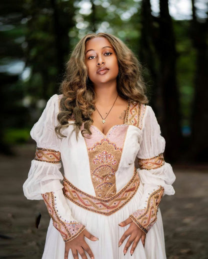Beautiful Habesha Dress with Elegant Pink and Gold Embroidery for Weddings