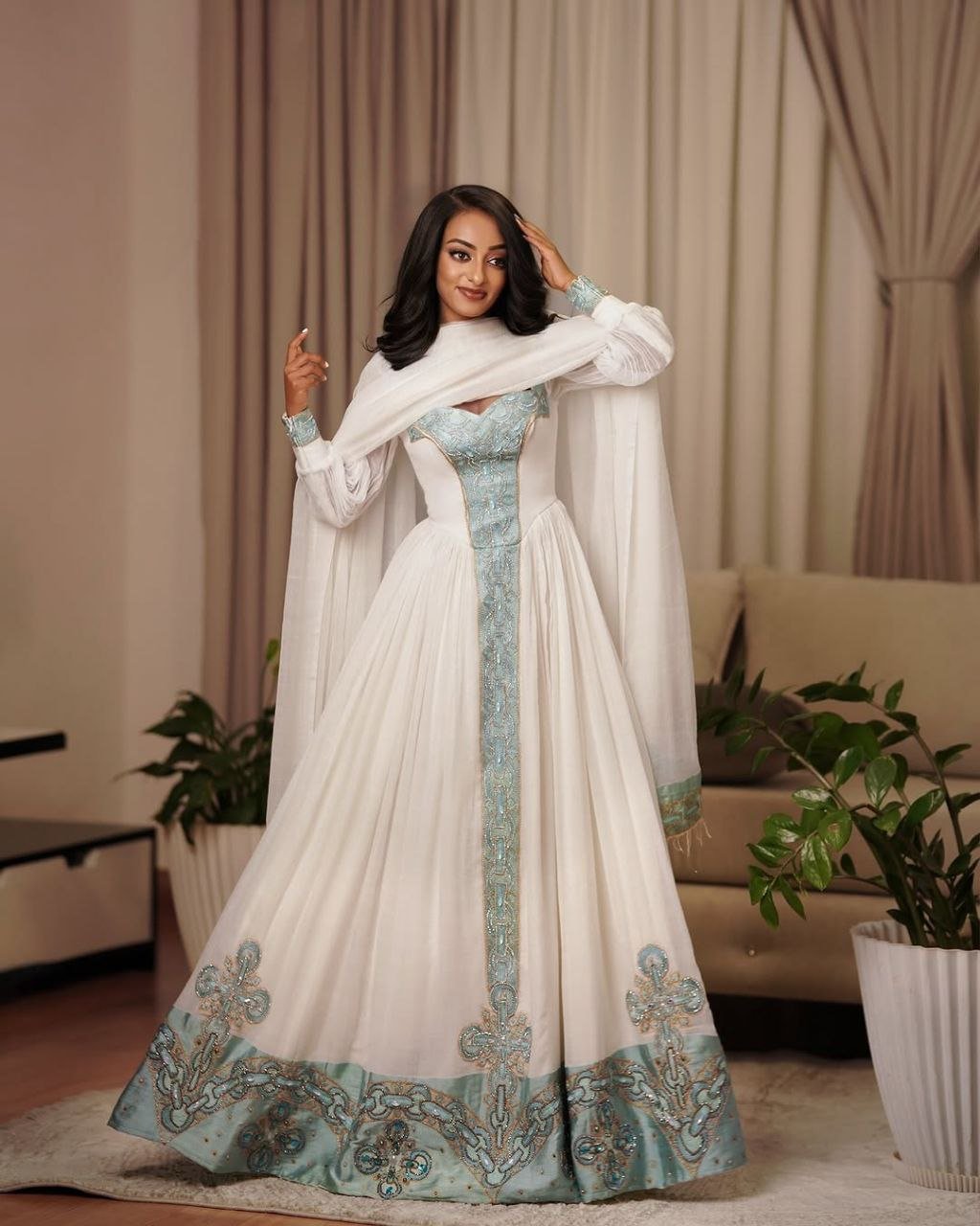 Elegant Habesha Dress with Aqua Blue Embroidery for Special Occasions