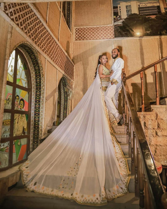 Regal Traditional Habesha Couples Attire with Flowing Veil for Wedding
