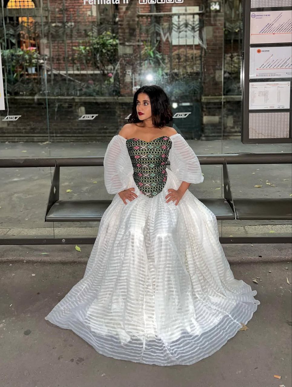 Vibrant Off-Shoulder Habesha Kemis Elegant Ethiopian Dress with Multi-Color Embroidered Bodice
