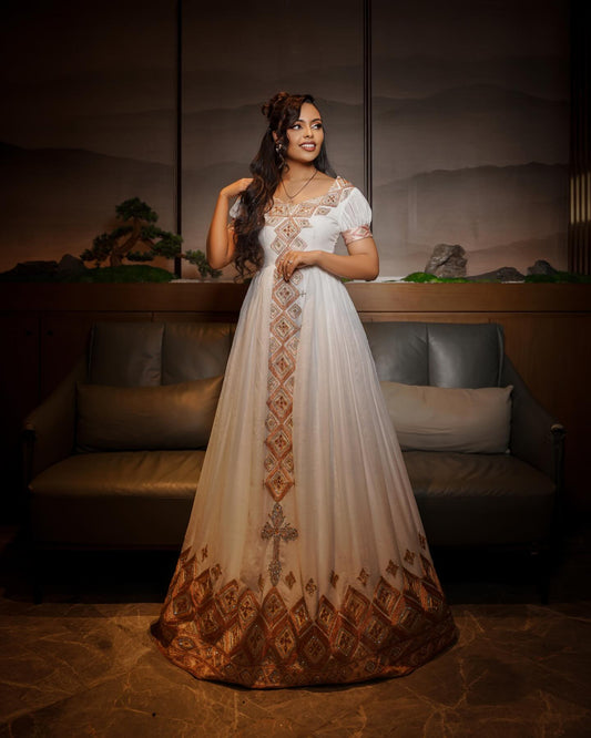Luxury White Habesha Kemis with Rose Gold Embroidery and Elegant Cultural Detailing