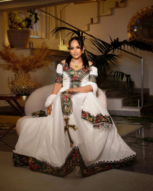 Elegant Off-Shoulder Habesha Kemis with Vibrant Multicolor Woven Cultural Details