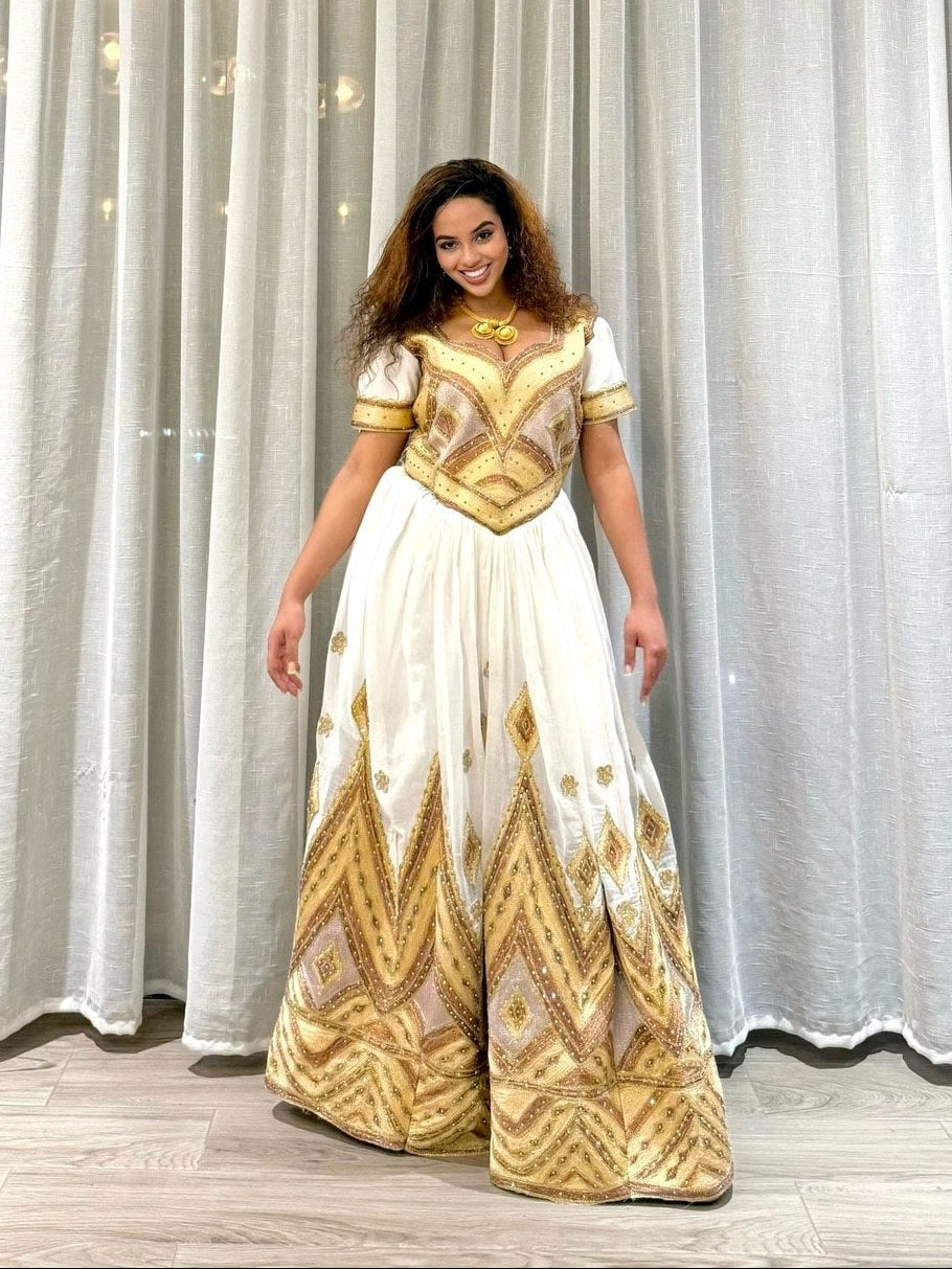 Golden Embroidered Habesha Kemis with Short Sleeve and Luxurious Cultural Elegance