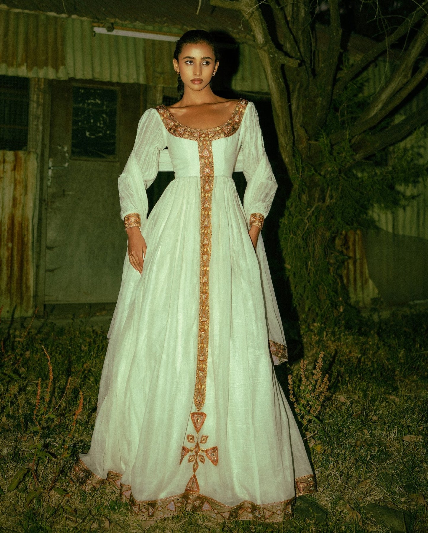 Timeless White Ethiopian Cultural Gown with Ornate Gold Handwoven Details 