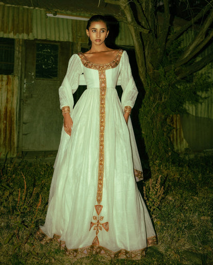 Timeless White Ethiopian Cultural Gown with Ornate Gold Handwoven Details 