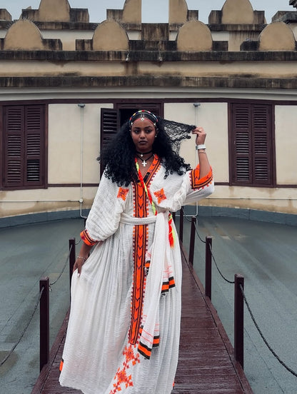 Traditional White Ethiopian Dress with Orange Tibeb Patterns