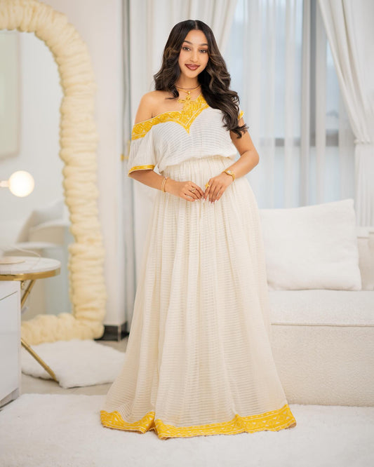 white and yellow embroidered ethiopian traditional dress made from habesha cloth