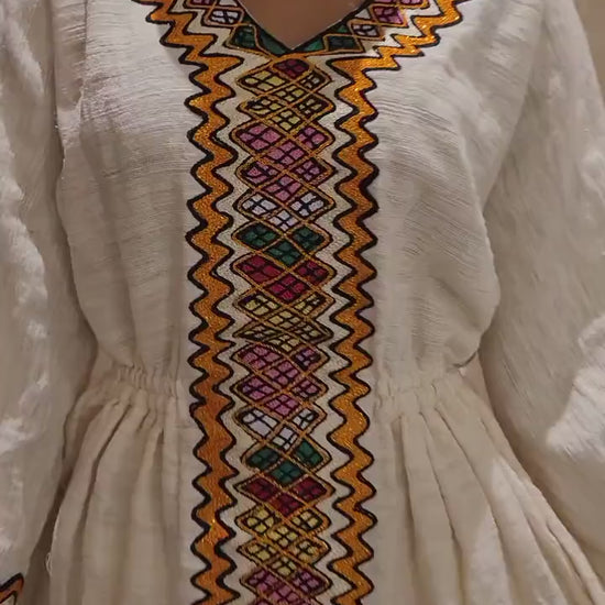 Vibrant Elegance: Pink and Orange Embroidered Habesha Dress – Celebrate Ethiopian & Eritrean Culture with this Stunning Masterpiece