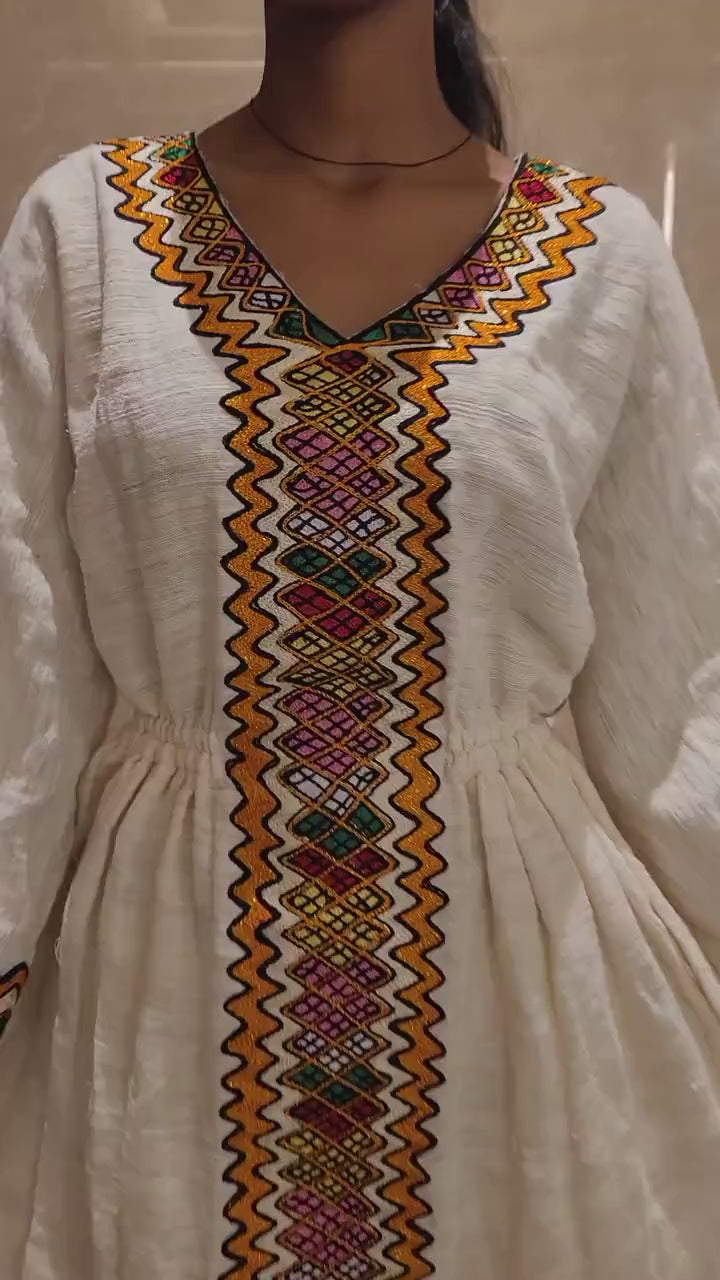 Vibrant Elegance: Pink and Orange Embroidered Habesha Dress – Celebrate Ethiopian & Eritrean Culture with this Stunning Masterpiece