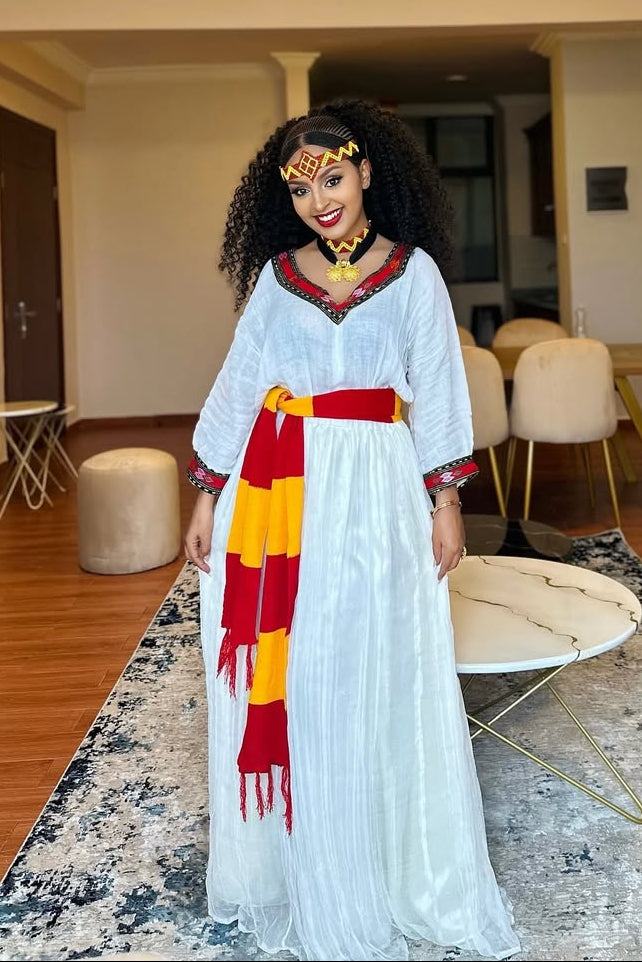 Elegant Ashenda Kemis with Bold Red and Yellow Accents – Eritrean Dress
