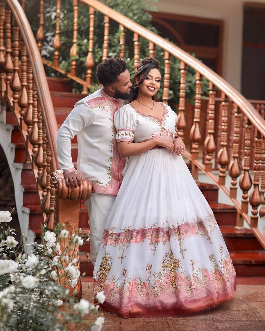 Glamorous  Light Pink Habesha Wedding Outfit with Matching Couple Design