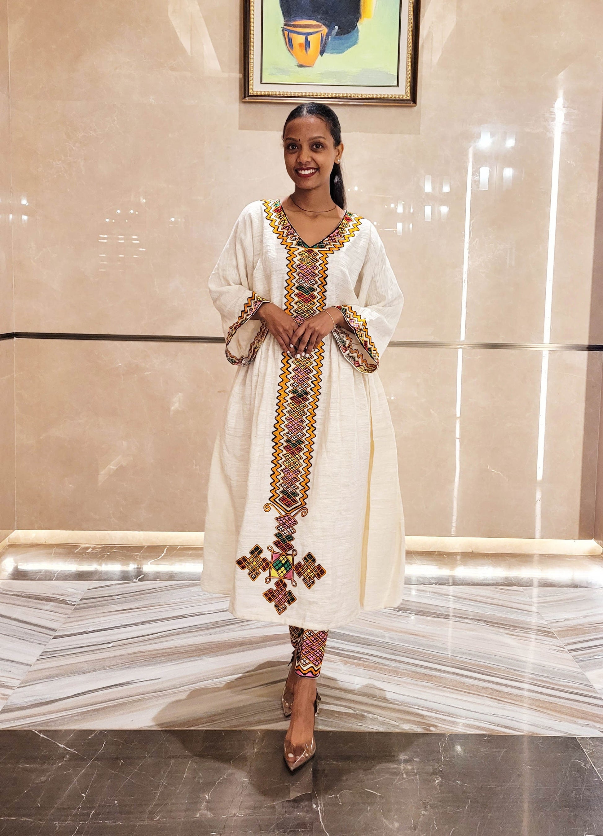 Vibrant Elegance: Pink and Orange Embroidered Habesha Dress – Celebrate Ethiopian & Eritrean Culture with this Stunning Masterpiece
