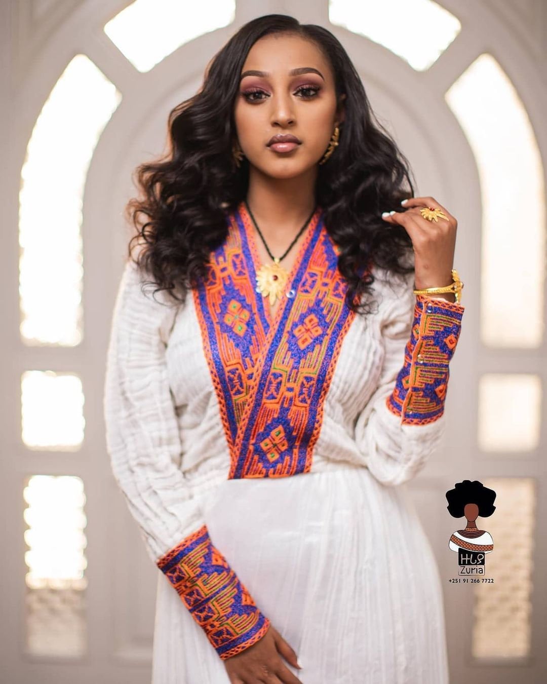 Artistic Elegance: Handwoven Vibrant Habesha Dress in Warm Colors
