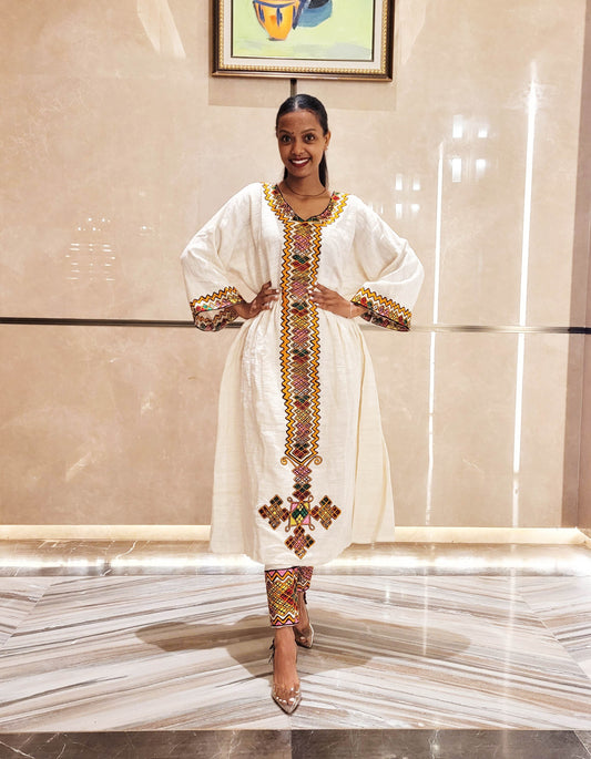 Vibrant Elegance: Pink and Orange Embroidered Habesha Dress – Celebrate Ethiopian & Eritrean Culture with this Stunning Masterpiece