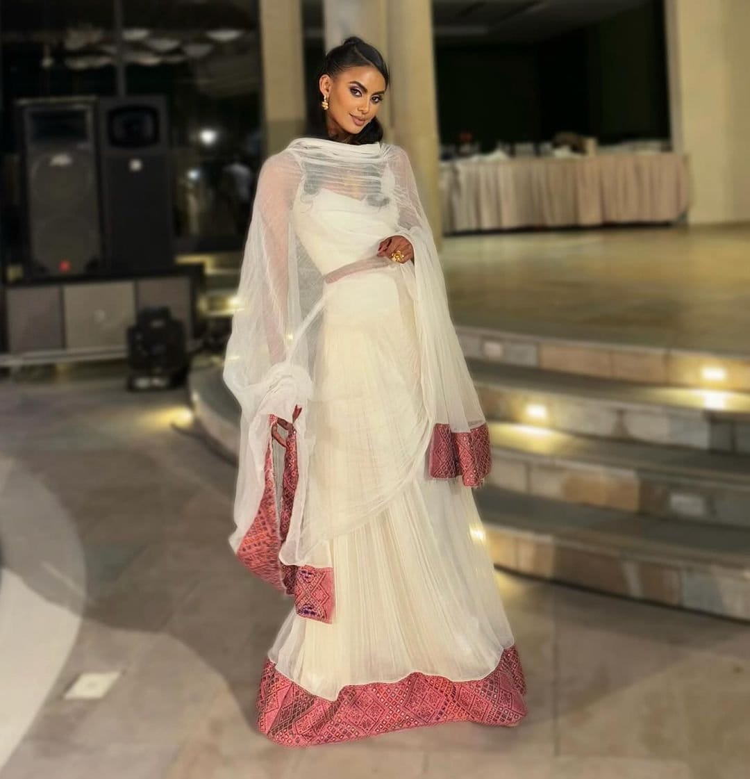 Elegant Light Pink Habesha Kemis Handwoven Habesha Dress with Exquisite Embroidery